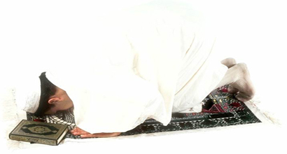 a person is performing sajdah.