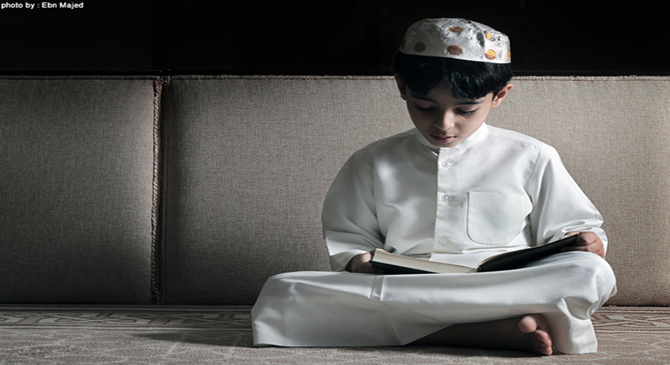 A boy is reciting the Qur'an.