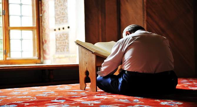 A person is reading the Qur'an.