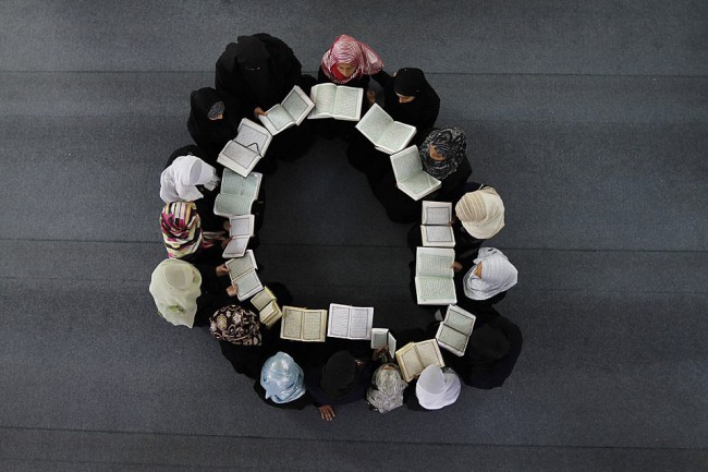 A group of Muslim women are studying the Qur'an.