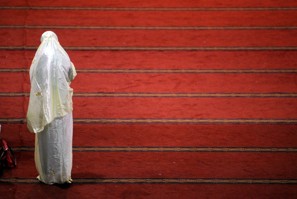 A women offer prayer at the mosque.