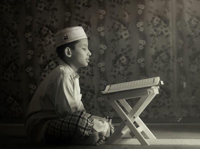 A boy recites the Qur'an