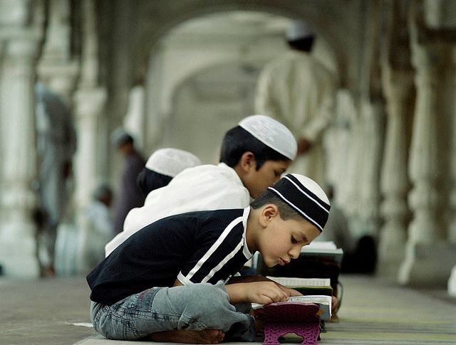 Some kids recite the Qur'an.